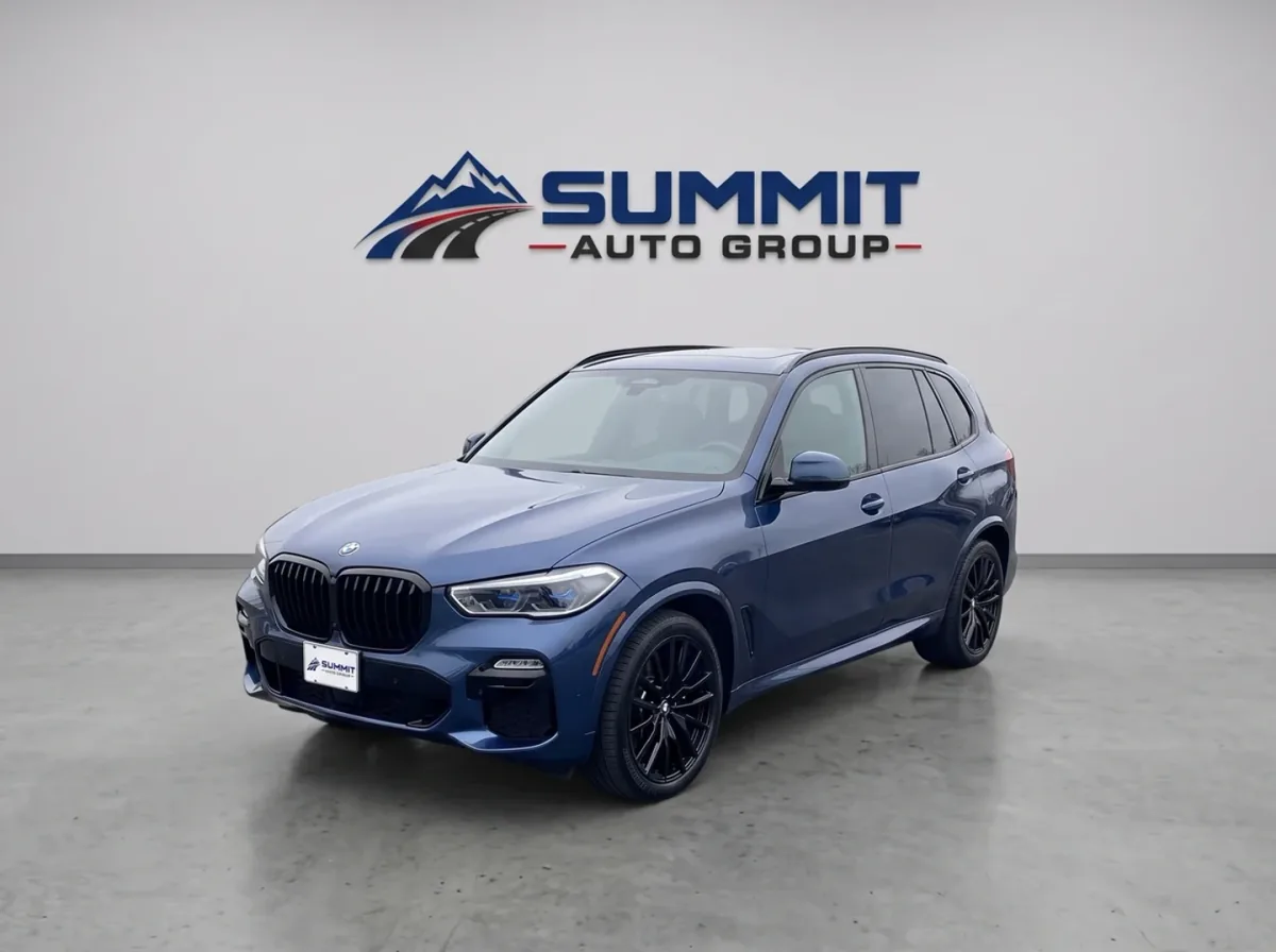 BMW X5 after CarPixAI processing in a clean Summit Auto Group dealership studio