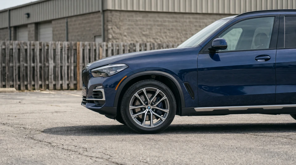 Blue BMW X5 inventory photo uploaded before editing with CarPixAI