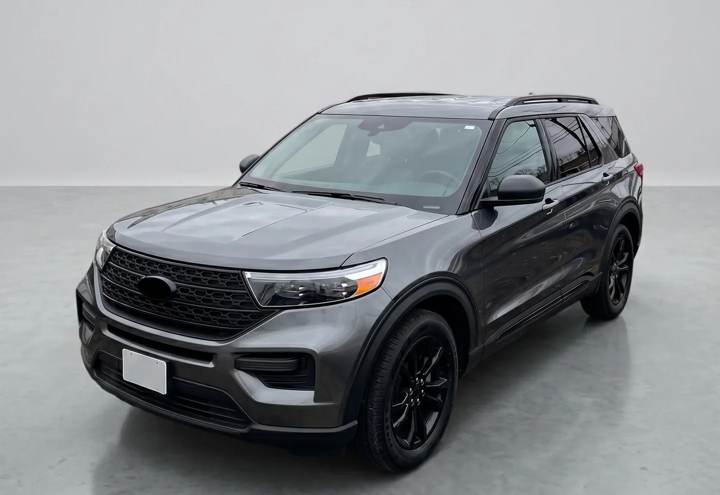 Ford Explorer after CarPixAI background replacement with a clean professional studio-style background